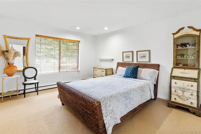 a bed room with a bed and a lamp