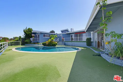 a view of a house with swimming pool