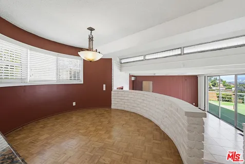 a large kitchen with stainless steel appliances granite countertop a sink and a stove