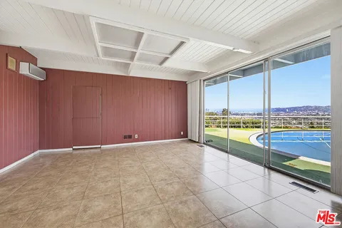 a view of an empty room with a balcony