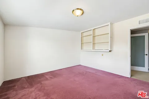 a view of a balcony with furniture