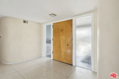 a view of a room with wooden walls