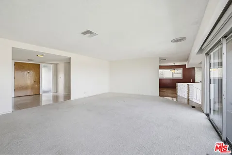 a kitchen with stainless steel appliances granite countertop a stove and a refrigerator