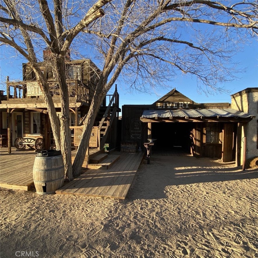 543050 Red Ryder Road Pioneertown, CA 92268 - Photo 13 of 20 a view of a building with a tree