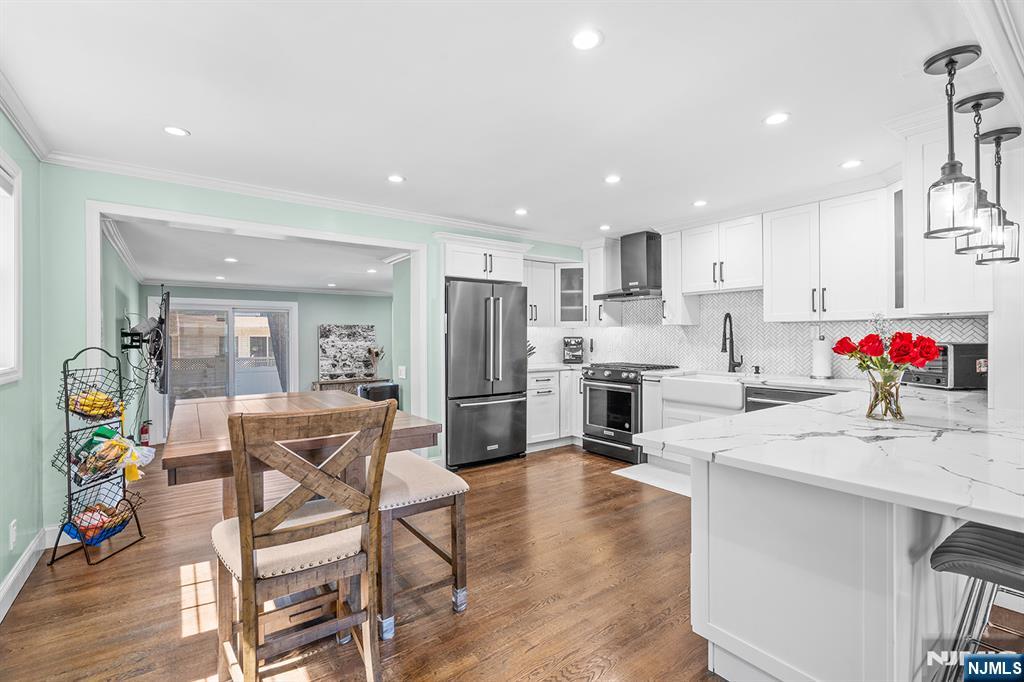 71 Wingra Avenue Rutherford, NJ 07070 - Photo 6 of 20 a kitchen with white cabinets and stainless steel appliances