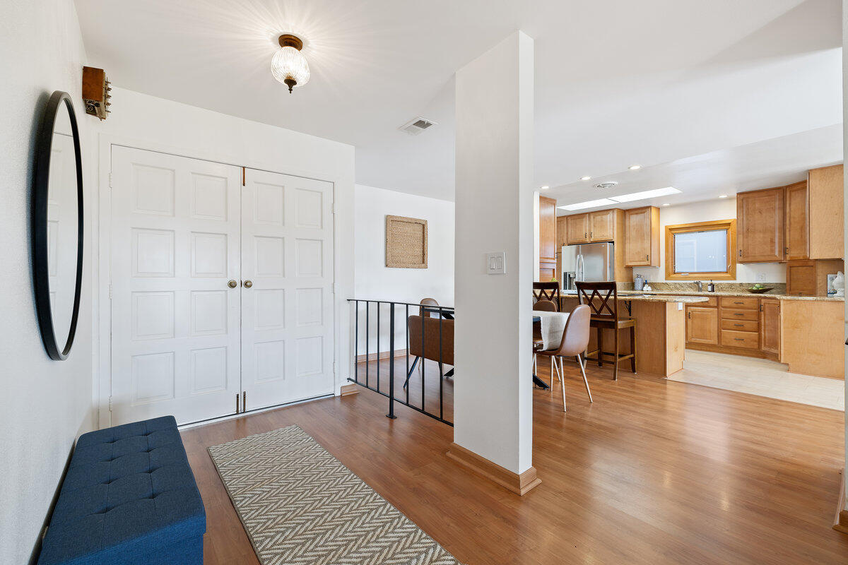 7165 Del Norte Drive Goleta, CA 93117 - Photo 13 of 30 a open kitchen with white cabinets and stainless steel appliances