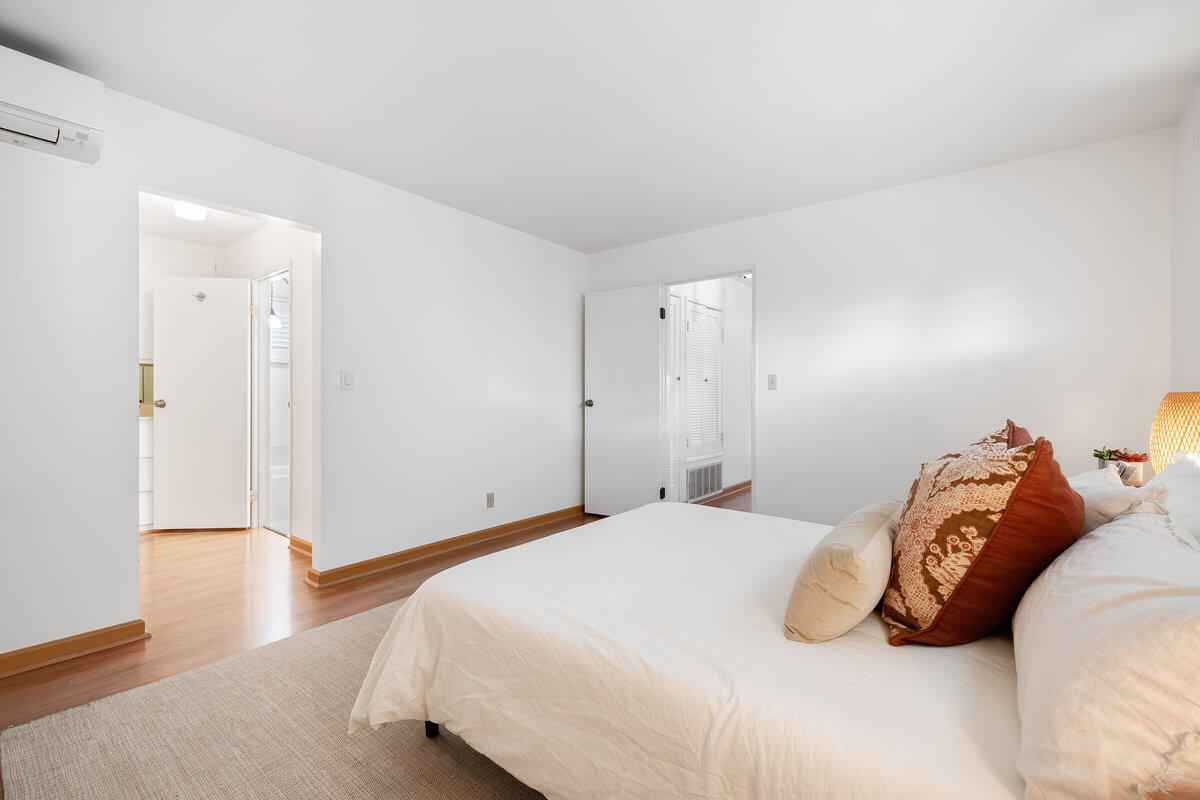 7165 Del Norte Drive Goleta, CA 93117 - Photo 14 of 30 a bedroom with a bed and wooden floor