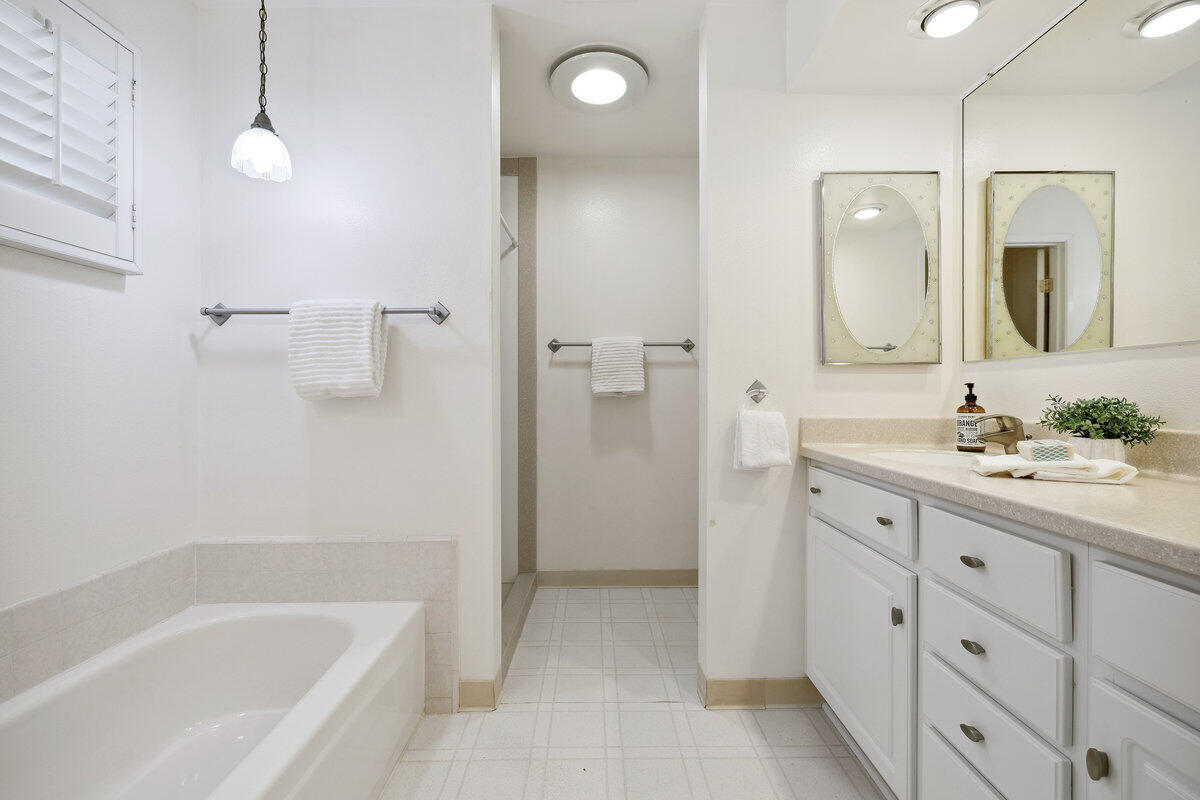 7165 Del Norte Drive Goleta, CA 93117 - Photo 16 of 30 a bathroom with a tub sink and mirror