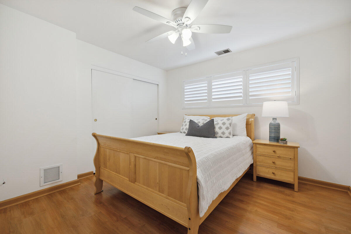 7165 Del Norte Drive Goleta, CA 93117 - Photo 18 of 30 a bed room with a bed and a ceiling fan