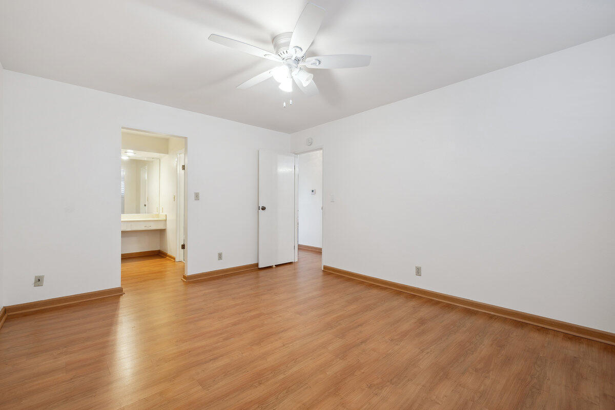 7165 Del Norte Drive Goleta, CA 93117 - Photo 22 of 30 an empty room with wooden floor and ceiling fan