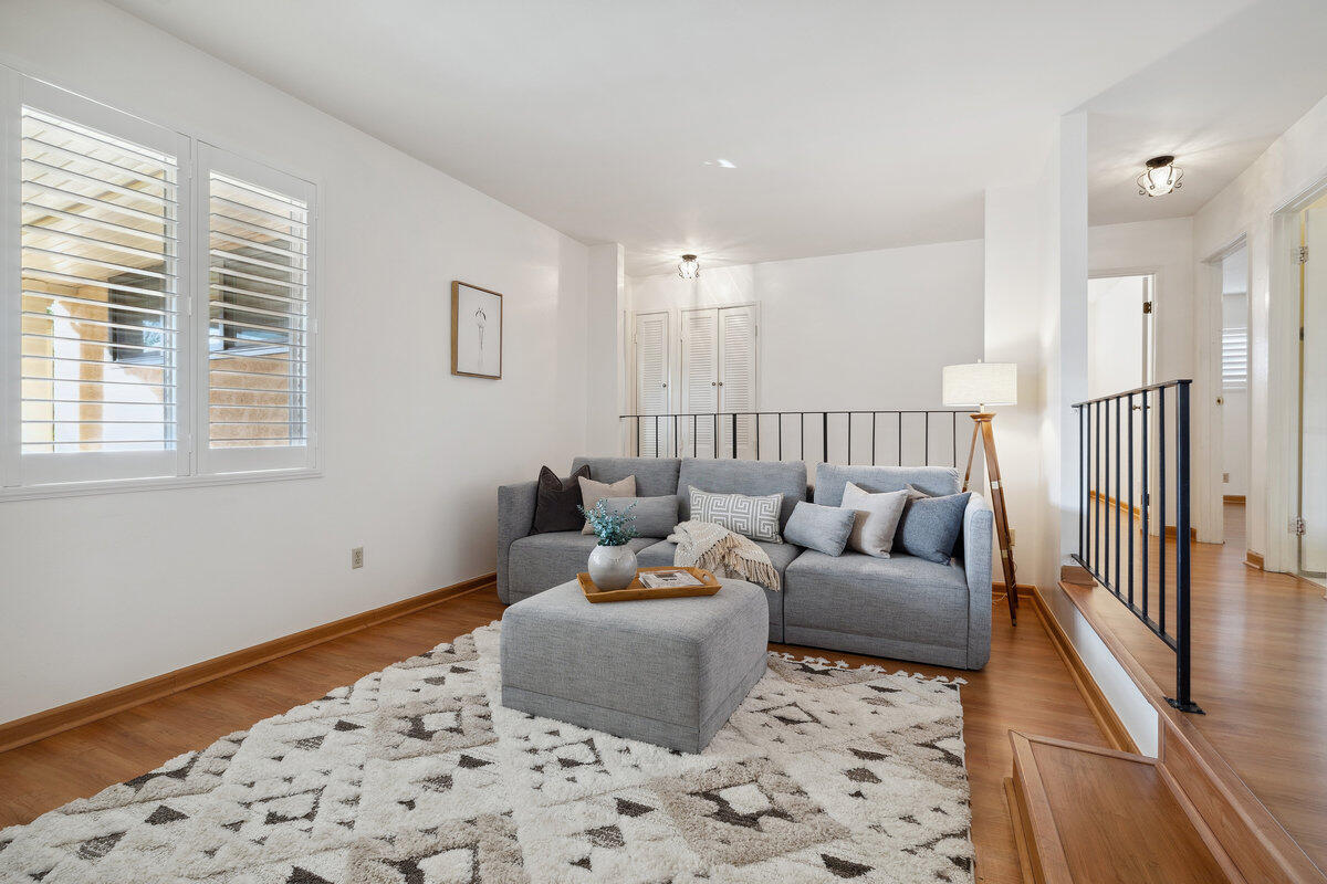 7165 Del Norte Drive Goleta, CA 93117 - Photo 3 of 30 a living room with furniture and wooden floor