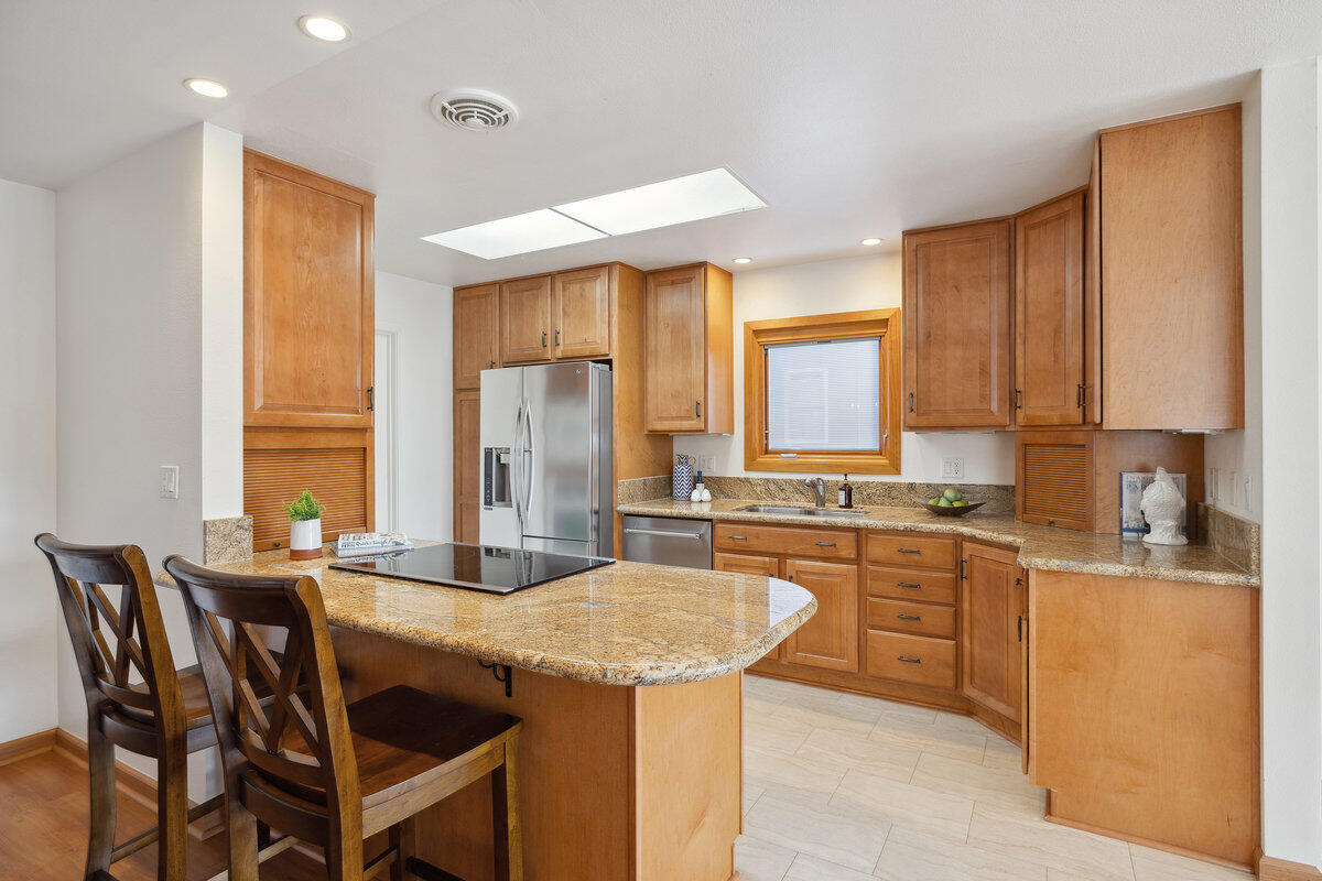 7165 Del Norte Drive Goleta, CA 93117 - Photo 6 of 30 a kitchen with a table chairs sink and cabinets