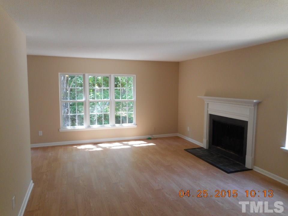 808 Green Ridge Drive Raleigh, NC 27609 - Photo 2 of 10 a view of empty room with a fireplace