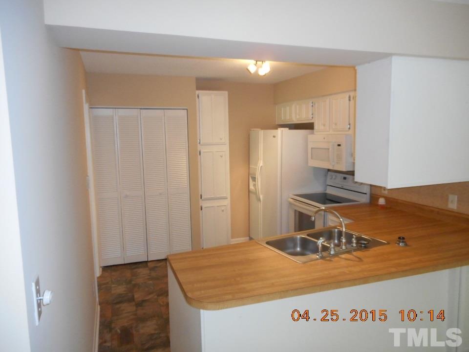 808 Green Ridge Drive Raleigh, NC 27609 - Photo 4 of 10 a room with a table and chairs