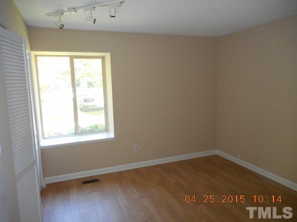 808 Green Ridge Drive Raleigh, NC 27609 - Photo 6 of 10 an empty room with a window