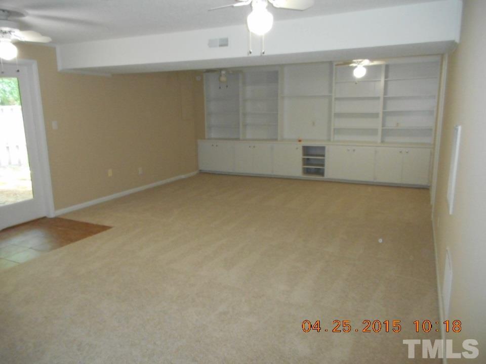 808 Green Ridge Drive Raleigh, NC 27609 - Photo 8 of 10 an empty room with cabinet and mirrors