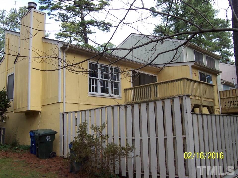808 Green Ridge Drive Raleigh, NC 27609 - Photo 10 of 10 a view of a house with a small yard and wooden fence