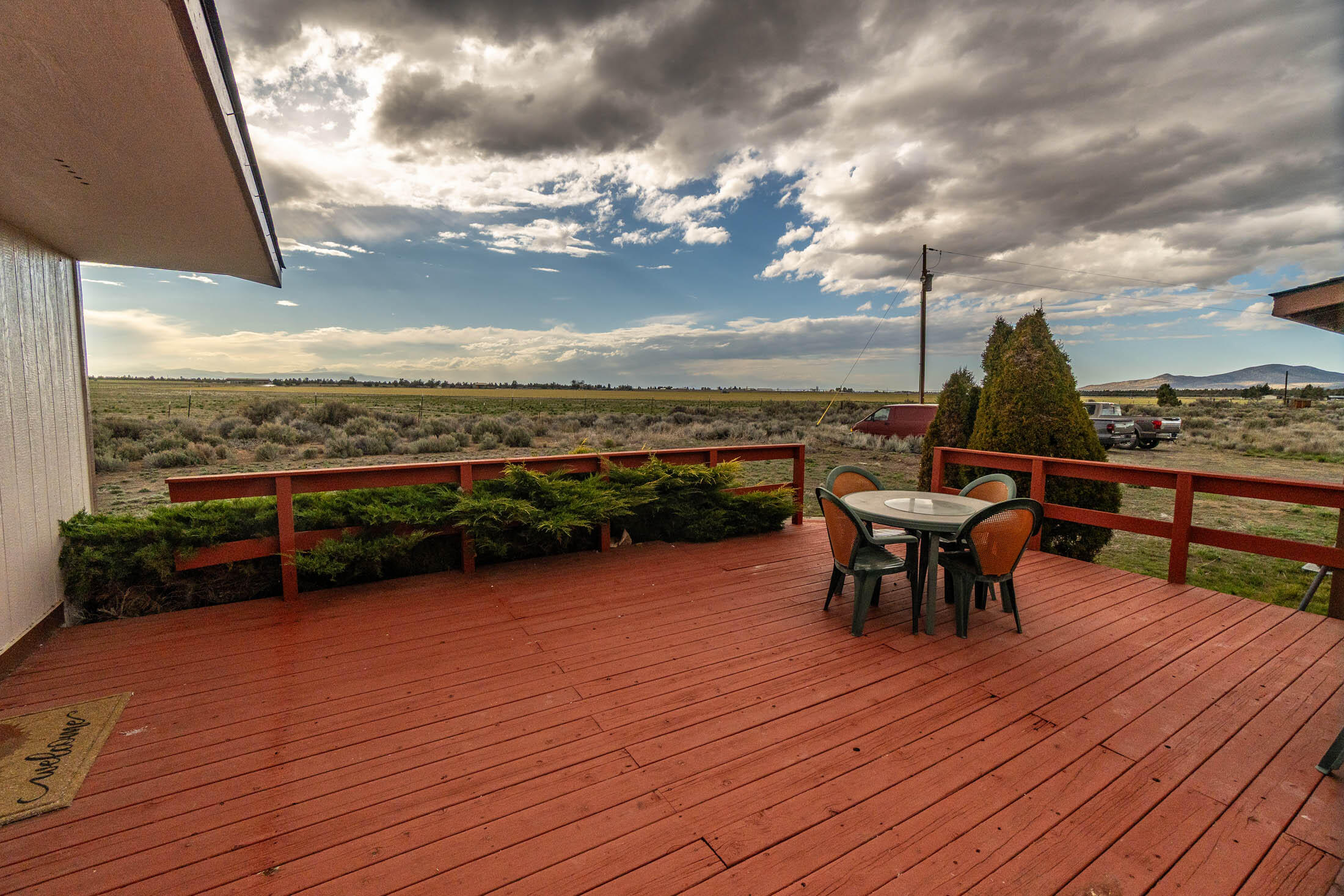 25907 South Cooper Street Bend, OR 97701 - Photo 22 of 34 a view of a terrace with outdoor seating