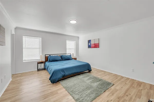 a living room with a bed furniture and a window