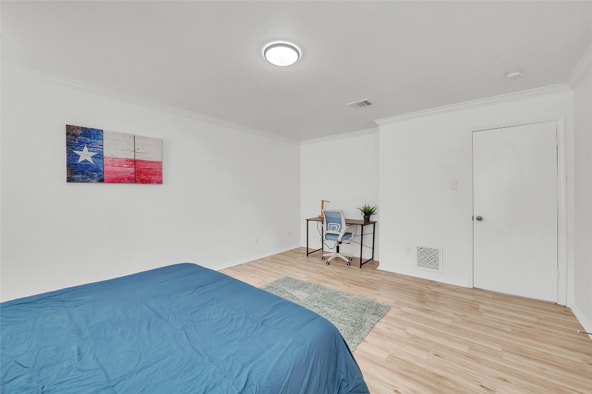 3514 Banda Lane Austin, TX 78725 - Photo 12 of 23 a bed room with a bed and a chair