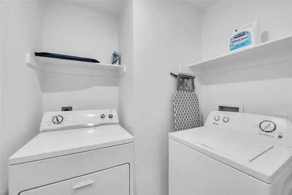 a utility room with dryer and washer