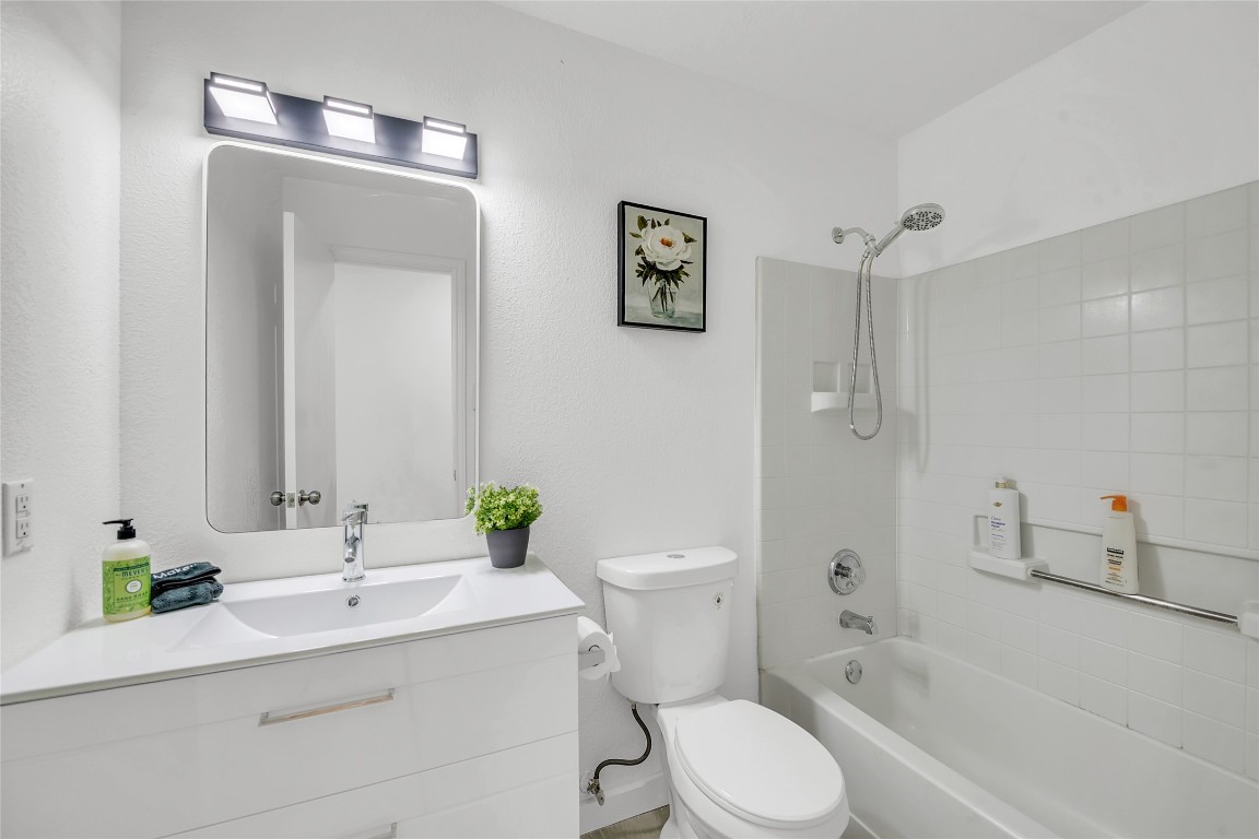 3514 Banda Lane Austin, TX 78725 - Photo 18 of 23 a bathroom with a sink toilet and shower