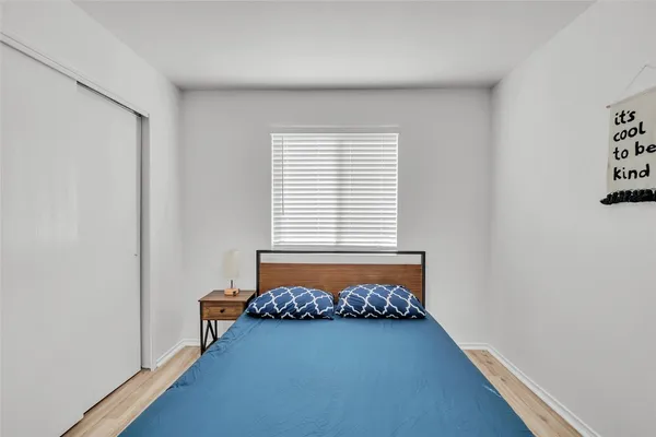 a room with bed and a window