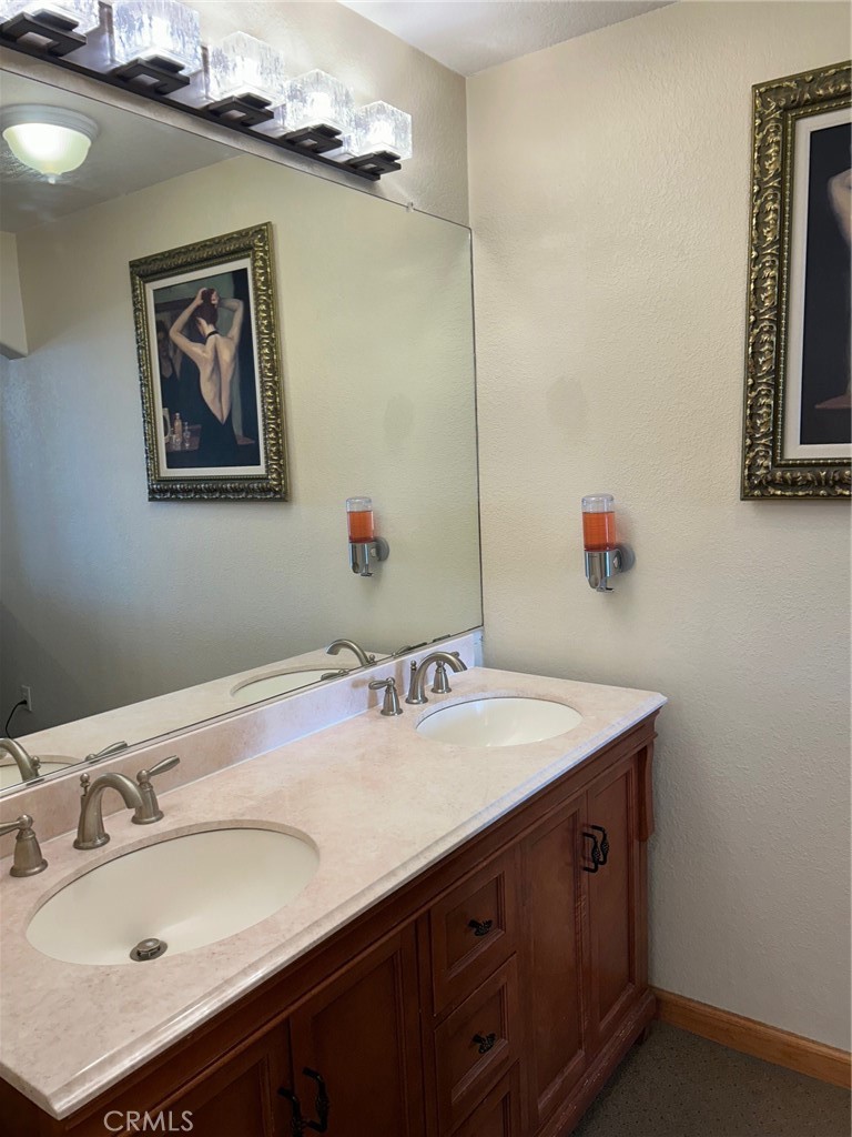 444 Pier Avenue, Unit 3 Oceano, CA 93445 - Photo 11 of 15 a bathroom with a sink and a mirror