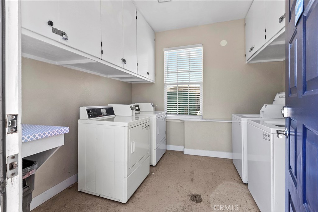 444 Pier Avenue, Unit 3 Oceano, CA 93445 - Photo 15 of 15 a utility room with cabinets washer and dryer