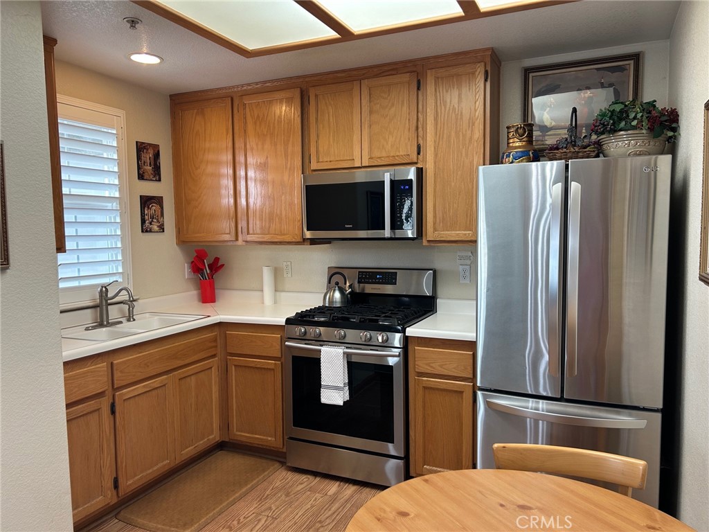 444 Pier Avenue, Unit 3 Oceano, CA 93445 - Photo 3 of 15 a kitchen with a sink stove and refrigerator