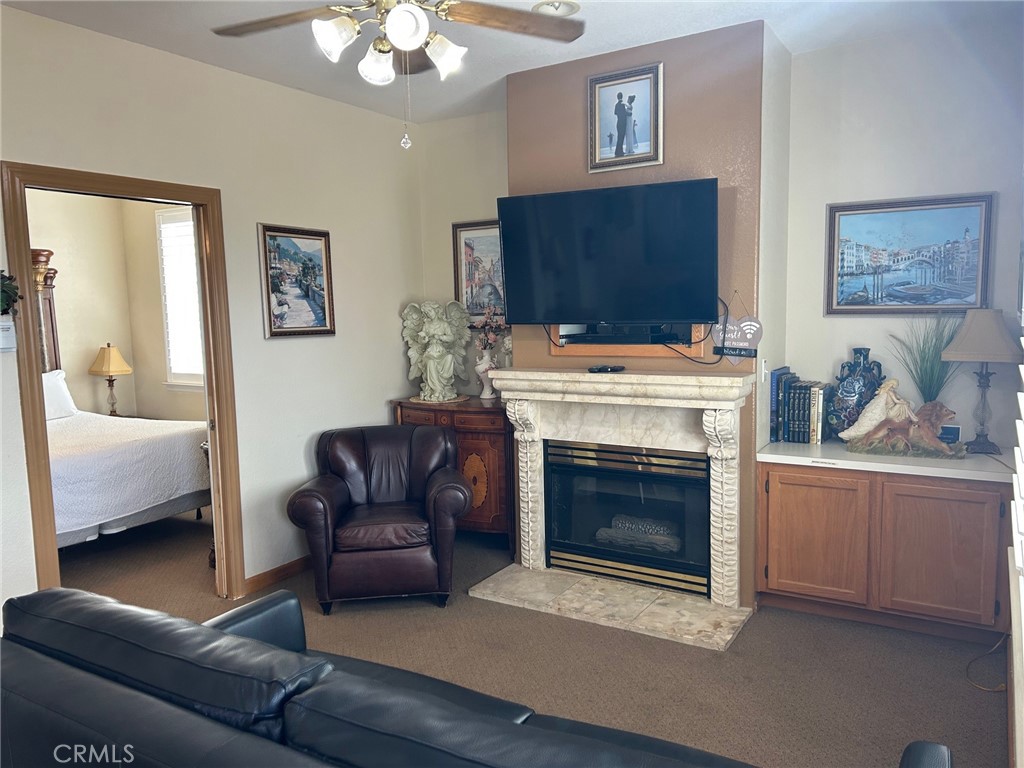 444 Pier Avenue, Unit 3 Oceano, CA 93445 - Photo 5 of 15 a living room with furniture and a fireplace
