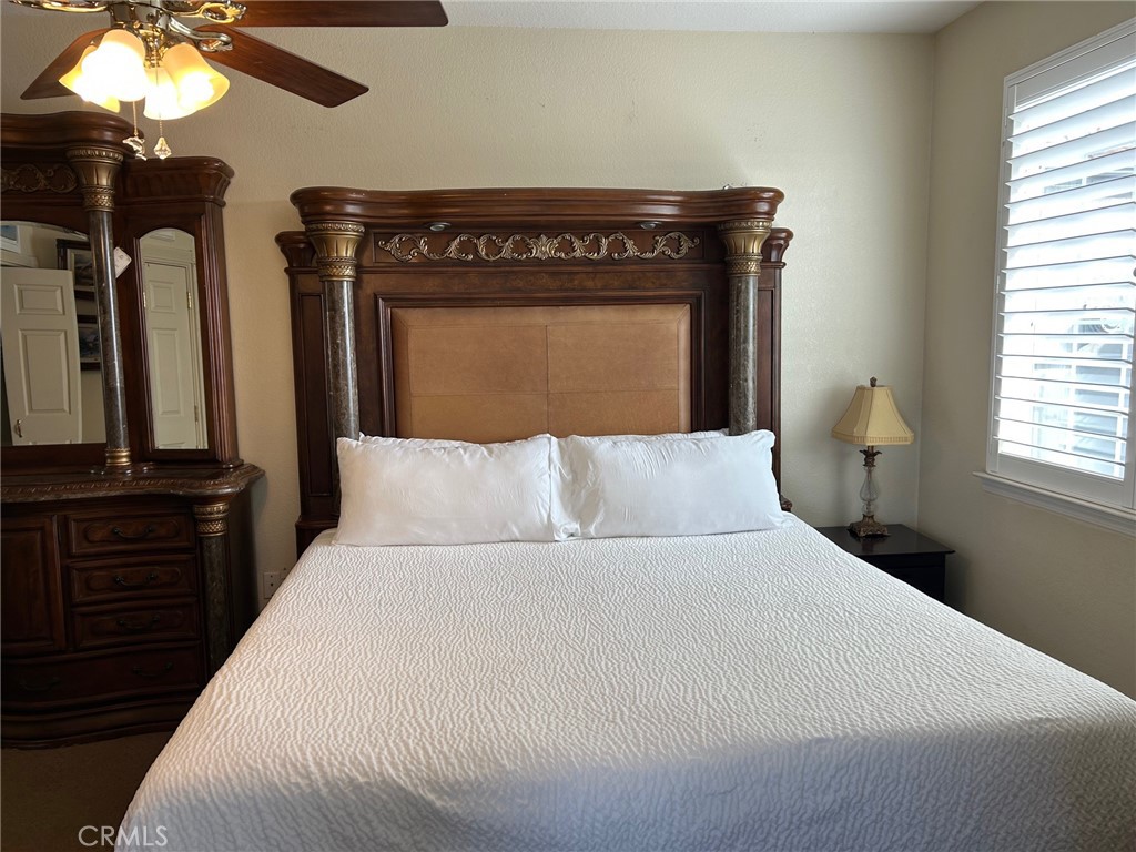 444 Pier Avenue, Unit 3 Oceano, CA 93445 - Photo 7 of 15 a bed room with a bed and a mirror