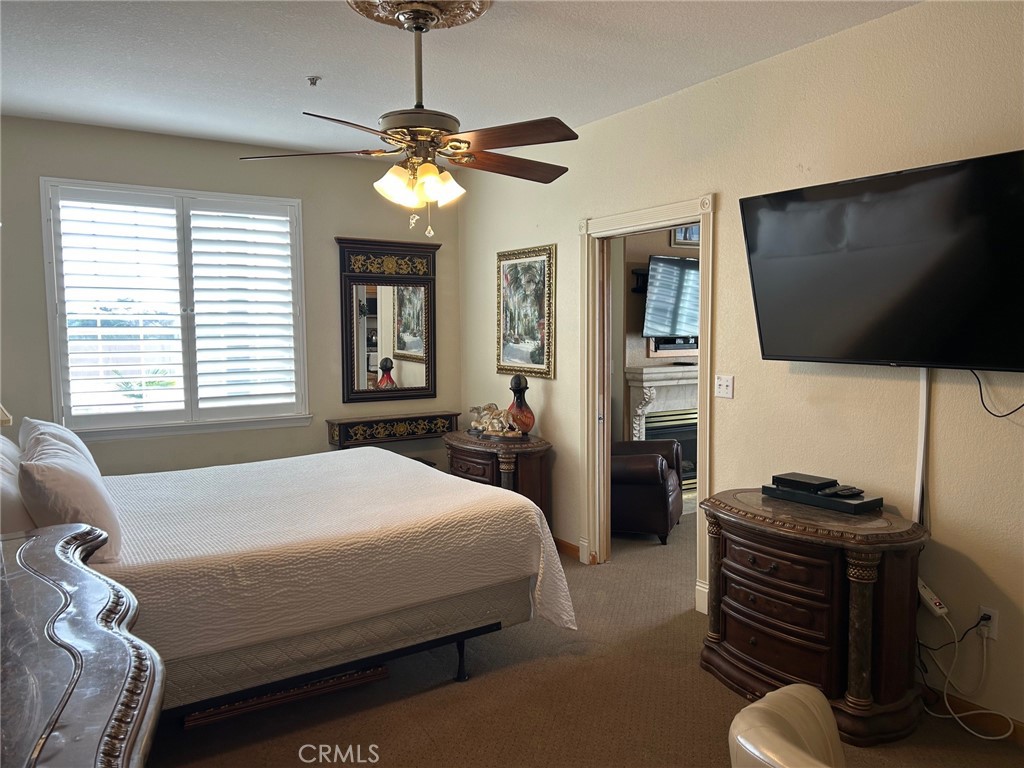 444 Pier Avenue, Unit 3 Oceano, CA 93445 - Photo 9 of 15 a bedroom with a bed and a flat screen tv