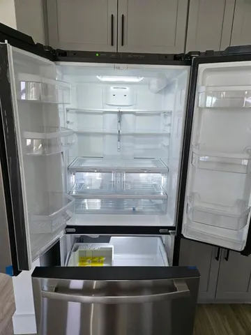 a room with water heater and racks