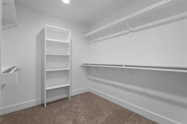 a view of an empty walk in closet