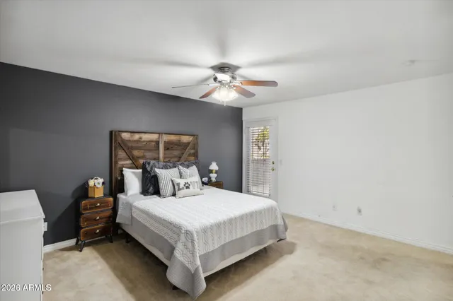 a bedroom with a bed and window