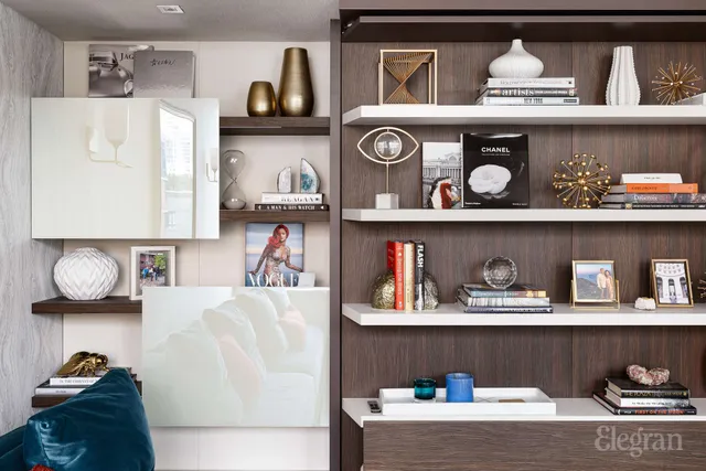 a living room with furniture and a bookshelf