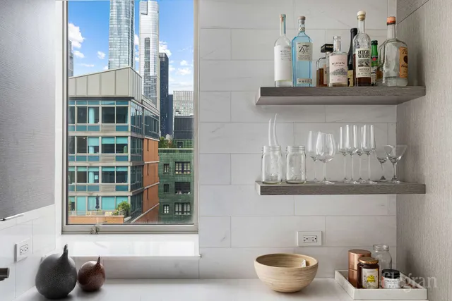 a kitchen with a sink stainless steel appliances and cabinets
