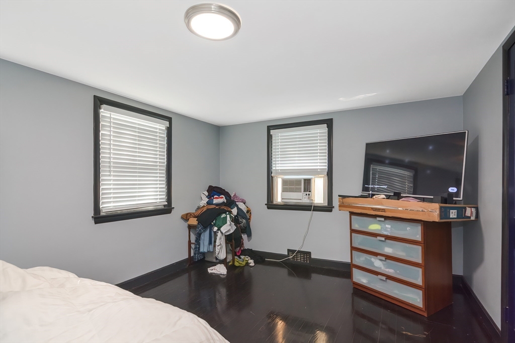 254 North Main Street Natick, MA 01760 - Photo 23 of 28 a living room with furniture and a flat screen tv