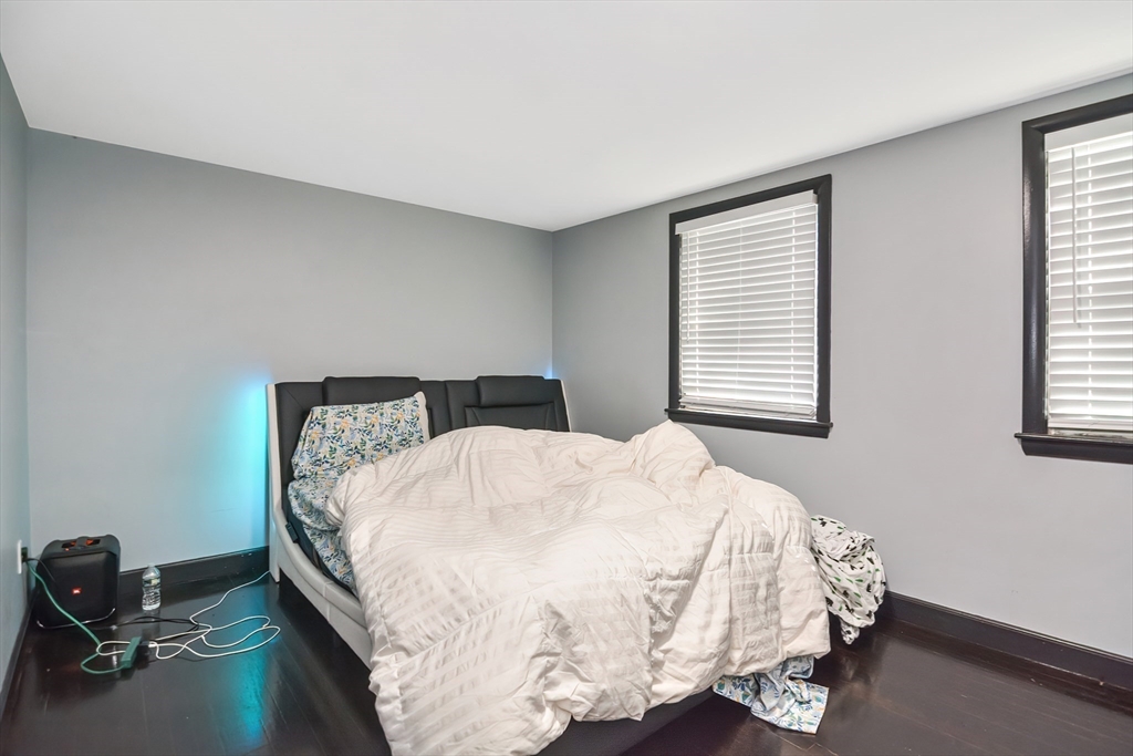 254 North Main Street Natick, MA 01760 - Photo 24 of 28 a bed sitting in a bedroom next to a window