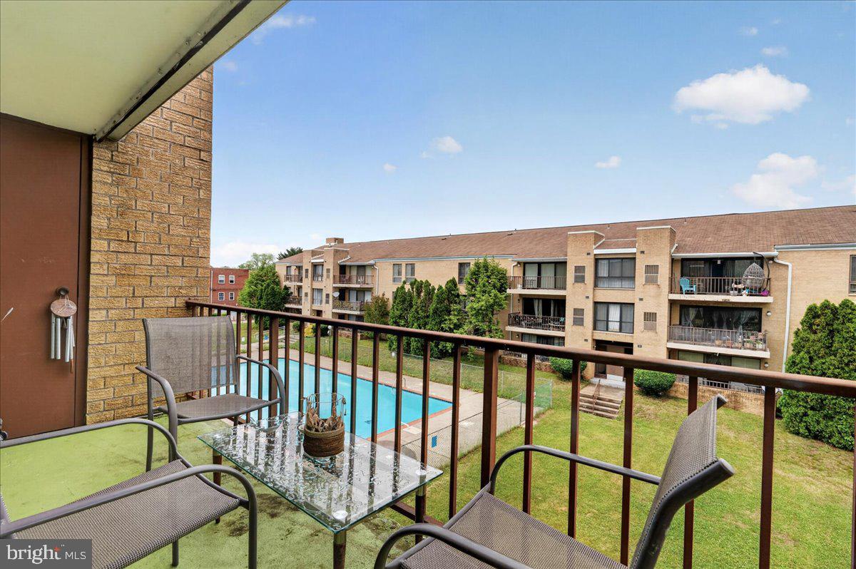 8930 Krewstown Road, Unit 310 Philadelphia, PA 19115 - Photo 25 of 32 a view of a chairs and table in the balcony