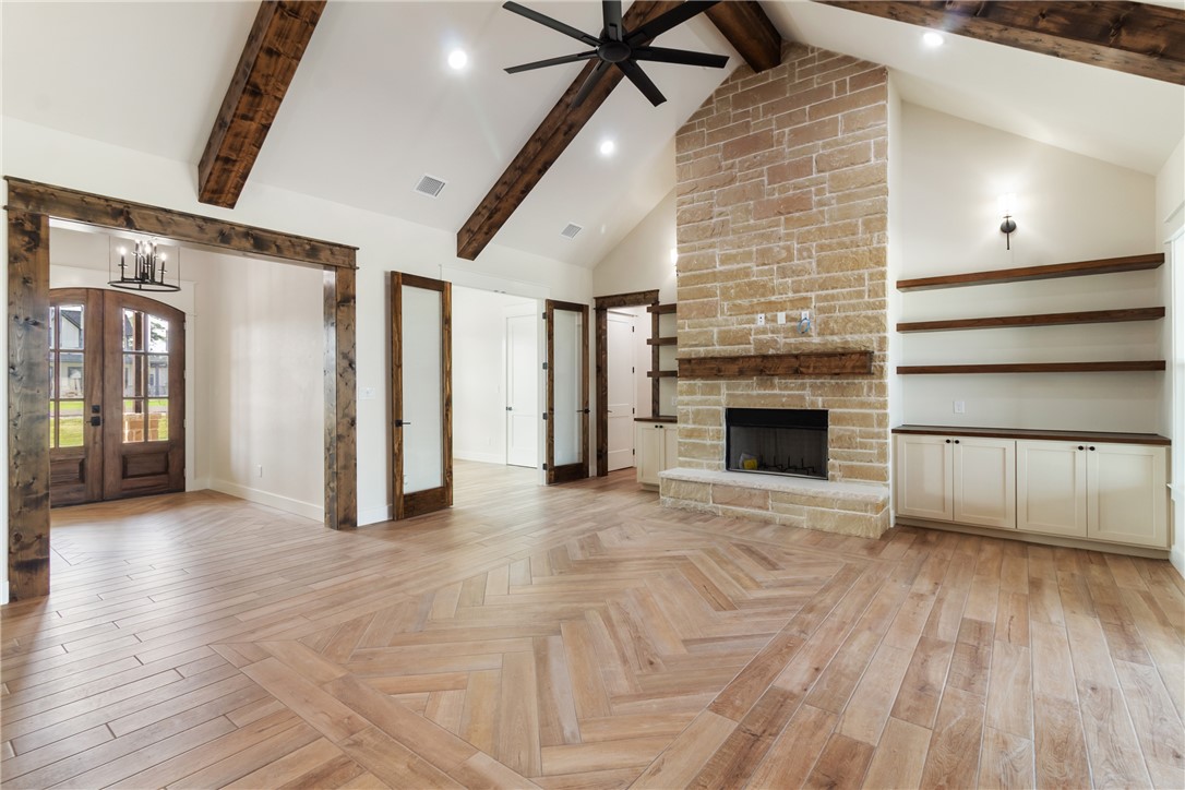 7822 Mathis Crk Drive Bryan, TX 77808 - Photo 3 of 43 a view of empty room with wooden floor and fireplace