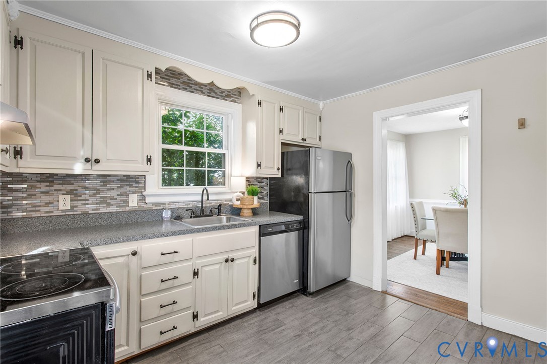6100 Club Road Henrico, VA 23228 - Photo 11 of 30 a kitchen with stainless steel appliances a refrigerator sink and cabinets