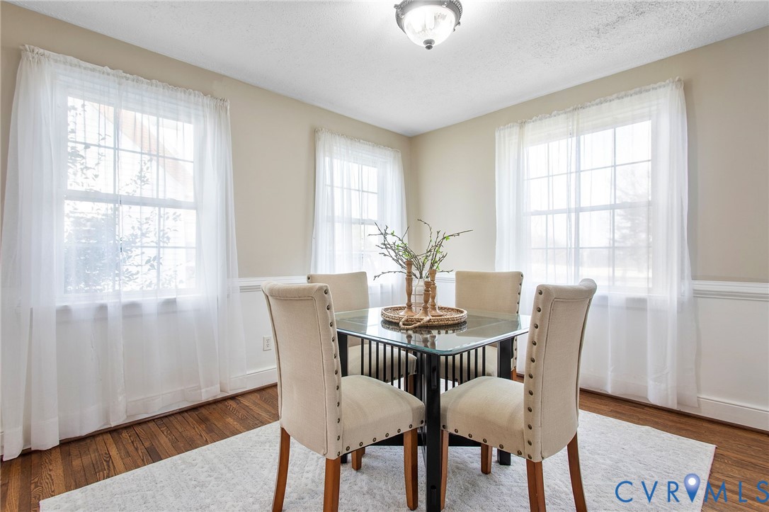 6100 Club Road Henrico, VA 23228 - Photo 14 of 30 a view of a dining room with furniture window and wooden floor