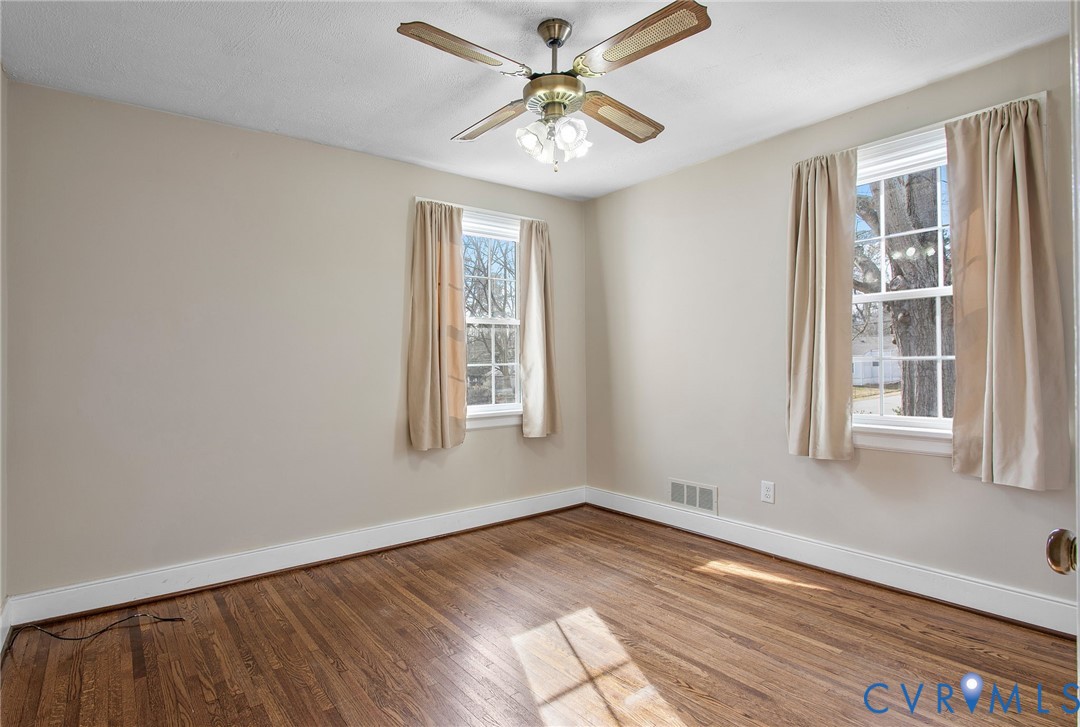 6100 Club Road Henrico, VA 23228 - Photo 15 of 30 an empty room with a window and a ceiling fan