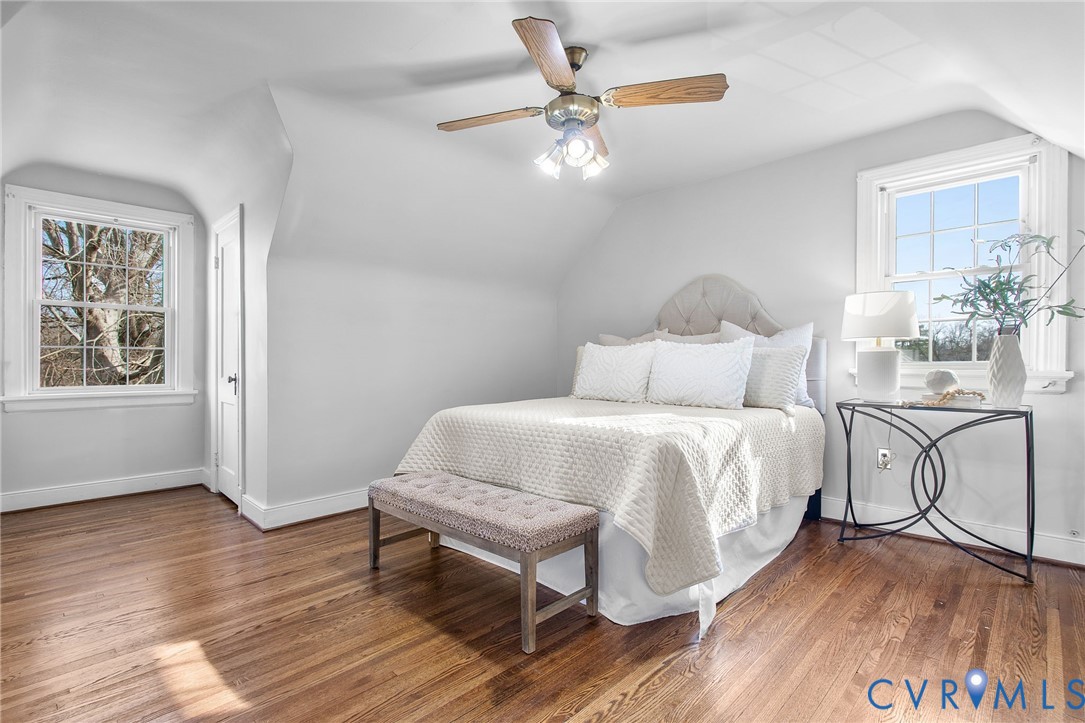 6100 Club Road Henrico, VA 23228 - Photo 20 of 30 a bedroom with a bed and a chandelier