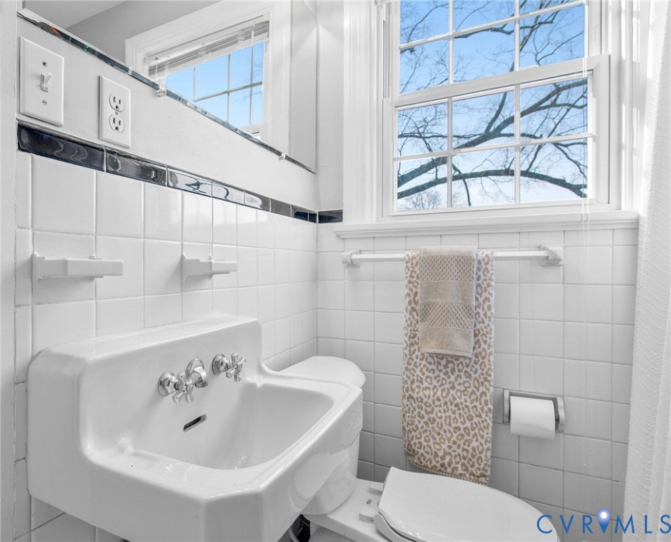 6100 Club Road Henrico, VA 23228 - Photo 22 of 30 a bathroom with a sink a toilet and shower