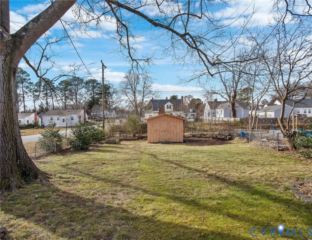 6100 Club Road Henrico, VA 23228 - Photo 28 of 30 a backyard of a house with large trees and outdoor seating