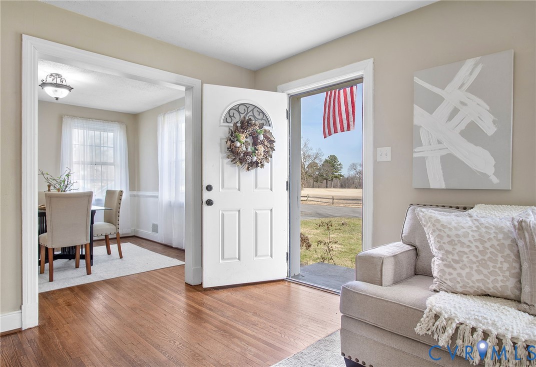 6100 Club Road Henrico, VA 23228 - Photo 6 of 30 a living room with furniture and a large window with wooden floor