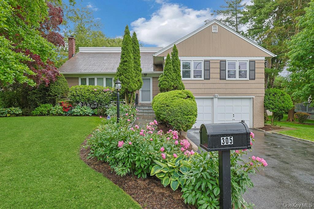 305 Stratton Road New Rochelle, NY 10804 - Photo 1 of 32 a front view of a house with garden